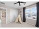 Bright bedroom featuring a neutral color palette and a cute teepee tent at 490 Silver Rock Trl, Castle Rock, CO 80104
