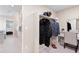View of closet with a vanity, hanging clothing, and adjoining bathroom at 490 Silver Rock Trl, Castle Rock, CO 80104