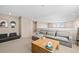 Upstairs living room with comfortable seating, a wooden coffee table, and ample natural light at 490 Silver Rock Trl, Castle Rock, CO 80104