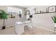 Bright home office with a large window, modern desk setup, and stylish decor accents at 490 Silver Rock Trl, Castle Rock, CO 80104