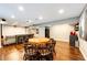 Finished basement with a kitchenette and seating area with a large table at 10890 Willow Reed West Cir, Parker, CO 80134