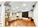 Finished basement media room with wood floors and a comfortable seating area at 10890 Willow Reed West Cir, Parker, CO 80134