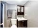 Small bathroom with gray walls, a vanity, and a toilet at 10890 Willow Reed West Cir, Parker, CO 80134