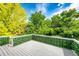 Outdoor deck with views of lush green trees and a blue sky at 10890 Willow Reed West Cir, Parker, CO 80134