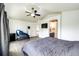 A spacious main bedroom with a vaulted ceiling, massage chair, and ensuite bathroom at 10890 Willow Reed West Cir, Parker, CO 80134