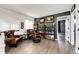 A cozy sitting area with decorative shelving and hardwood floors, perfect for relaxing and reading at 10890 Willow Reed West Cir, Parker, CO 80134