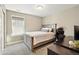 This bedroom has a neutral color scheme, carpet, and natural lighting from a single window at 7949 S Elk Way, Aurora, CO 80016