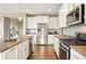 Bright kitchen offers stainless appliances, granite counters, and ample cabinet space at 7949 S Elk Way, Aurora, CO 80016