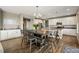 Eat-in kitchen with stainless steel appliances, a large island, and ample cabinet space at 7949 S Elk Way, Aurora, CO 80016