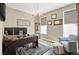 Well-lit home office with neutral colors, decorative lighting, and built in shelving at 7949 S Elk Way, Aurora, CO 80016