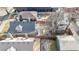 Aerial view showcasing a backyard with a hot tub, fire pit, patio dining, and modern homes at 3825 Tejon St, Denver, CO 80211