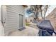 Backyard with a door to the garage, outdoor seating and grill at 3825 Tejon St, Denver, CO 80211