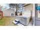Landscaped backyard featuring a studio with an outdoor staircase, a stone firepit, and a luxurious hot tub at 3825 Tejon St, Denver, CO 80211