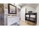 Bright bathroom with tile flooring, a stylish vanity, and a decorative mirror at 3825 Tejon St, Denver, CO 80211