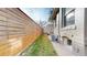 Exterior view of the home showing a well-maintained side yard and access to outdoor equipment at 3825 Tejon St, Denver, CO 80211