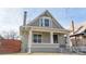 Charming two-story home with a covered front porch and attractive architectural details at 3825 Tejon St, Denver, CO 80211