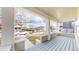 Inviting covered front porch with classic columns and a view of the neighborhood at 3825 Tejon St, Denver, CO 80211