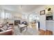 Bright and airy living room with a fireplace, hardwood floors, and an open layout at 3825 Tejon St, Denver, CO 80211