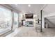 Open-plan living space with deck access, built-in features, and modern bar seating at 3825 Tejon St, Denver, CO 80211