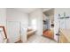 Mud room with bench and hooks, with a view to the kitchen and living room at 3825 Tejon St, Denver, CO 80211