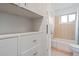 Bright bathroom includes a tub/shower combination, updated vanity, and ample storage at 60 Yarrow St, Lakewood, CO 80226