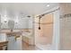 This elegant bathroom features both a luxurious tub and a separate shower area at 60 Yarrow St, Lakewood, CO 80226