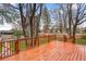 A spacious wooden deck perfect for outdoor entertaining, with an open view of the landscaped yard at 60 Yarrow St, Lakewood, CO 80226