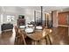 Open concept dining and living space with natural light and hardwood floors at 60 Yarrow St, Lakewood, CO 80226