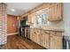 Well-lit kitchen features stainless appliances, wood cabinets, and modern fixtures at 60 Yarrow St, Lakewood, CO 80226