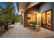 Cozy back deck with outdoor seating and tree views at 3816 Spring Valley Trl, Evergreen, CO 80439