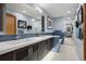 Sleek bathroom featuring dual sinks, modern fixtures, and a walk-in shower at 3816 Spring Valley Trl, Evergreen, CO 80439