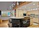 Modern kitchen with a center island, stainless steel appliances, and contemporary finishes at 3816 Spring Valley Trl, Evergreen, CO 80439