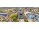 An aerial view reveals this home with solar panels on the roof, in a neighborhood full of mature trees at 2119 W 101St Cir, Thornton, CO 80260