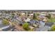 This aerial view shows a home nestled amongst other homes, many of which have solar panels on the roof at 2119 W 101St Cir, Thornton, CO 80260