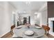 An open dining area adjacent to a kitchen boasts a modern aesthetic and inviting layout at 2119 W 101St Cir, Thornton, CO 80260