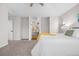 Comfortable bedroom includes a view to an adjacent bathroom with warm color accents at 2119 W 101St Cir, Thornton, CO 80260