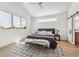 Bright bedroom features a modern ceiling fan, large window, and stylish furnishings at 964 Quitman St, Denver, CO 80204