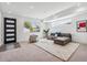 Cozy living room with modern sectional, accent chair, and contemporary decor at 964 Quitman St, Denver, CO 80204