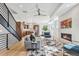 Open-concept design features hardwood floors, modern decor, and a kitchen with stainless steel appliances at 964 Quitman St, Denver, CO 80204