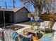 Landscaped backyard featuring patio seating, a built-in bar, and mature trees at 2725 N Gaylord St, Denver, CO 80205