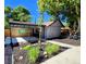 Outdoor bar area with a covered patio and landscaped yard at 2725 N Gaylord St, Denver, CO 80205