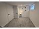 Finished basement with neutral carpet, white trim, and window for natural light at 2725 N Gaylord St, Denver, CO 80205