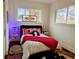 Cozy bedroom featuring a comfortable bed, soft lighting, and windows providing natural light, creating a warm ambiance at 2725 N Gaylord St, Denver, CO 80205