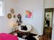 Cozy bedroom featuring unique decor, a faux fur chair and colorful modern wall art at 2725 N Gaylord St, Denver, CO 80205