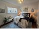 Bright bedroom with a comfortable queen-sized bed, decorative pillows, bedside tables with lamps, and a cozy rug at 2725 N Gaylord St, Denver, CO 80205