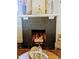 Inviting fireplace with dark brick and decorative mantel at 2725 N Gaylord St, Denver, CO 80205
