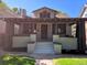 Inviting front porch with brick pillars and a covered entrance at 2725 N Gaylord St, Denver, CO 80205