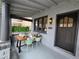 Charming porch with a table and chairs, perfect for outdoor dining at 2725 N Gaylord St, Denver, CO 80205