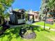 Charming two-story home with a well-manicured lawn, landscaping, and a real estate sign at 2725 N Gaylord St, Denver, CO 80205