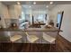 Modern kitchen with breakfast bar, stainless steel appliances, and ample counter space at 2725 N Gaylord St, Denver, CO 80205